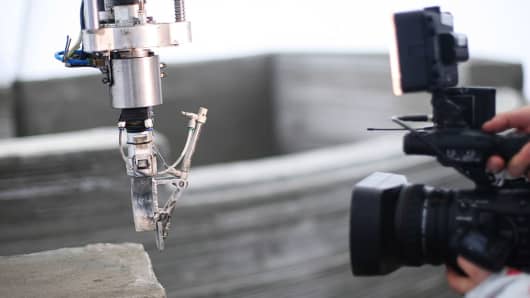 An Apis Cor 3D Printer prints a house at the Stupino Aerated Concrete Plant in Moscow, Russia on 9 Dec. 2016.