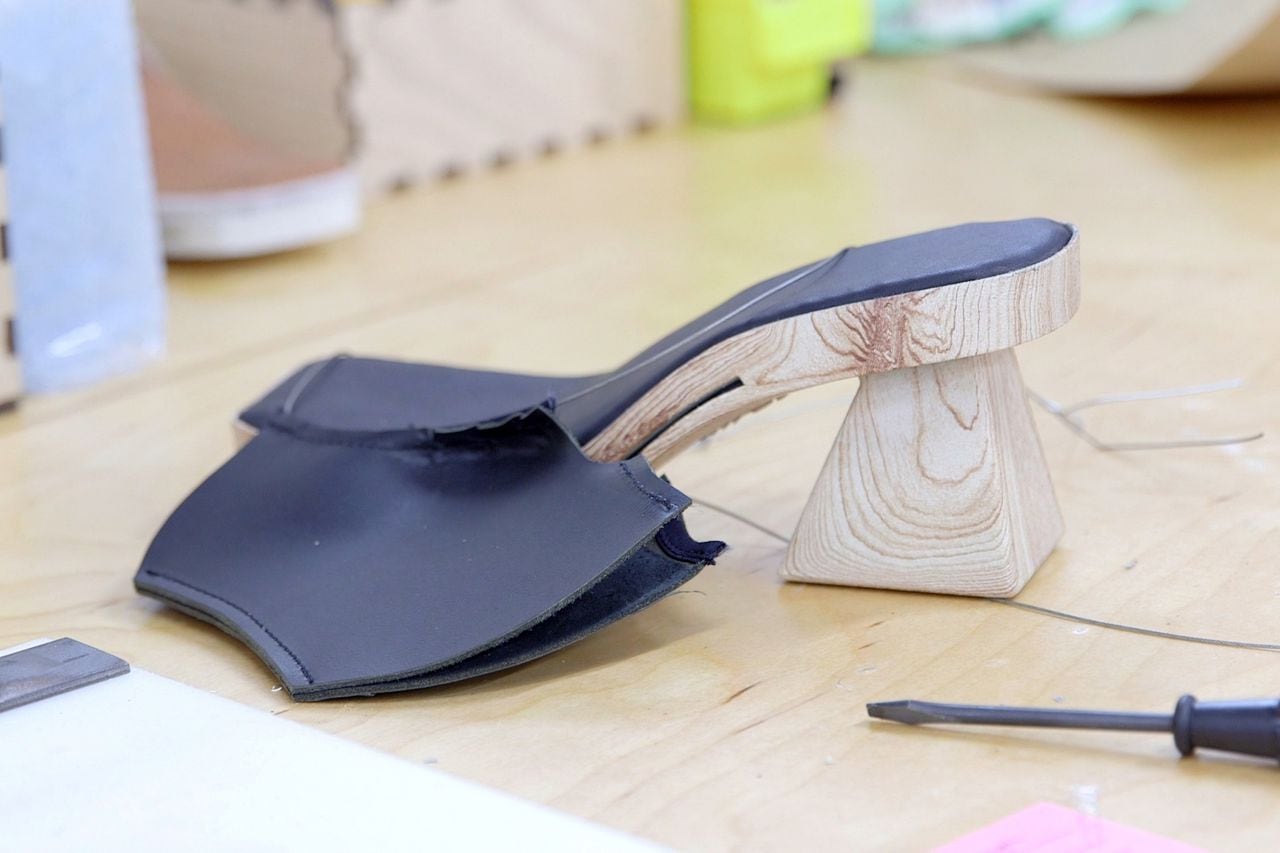 A 3D printed shoe being assembled with on a table