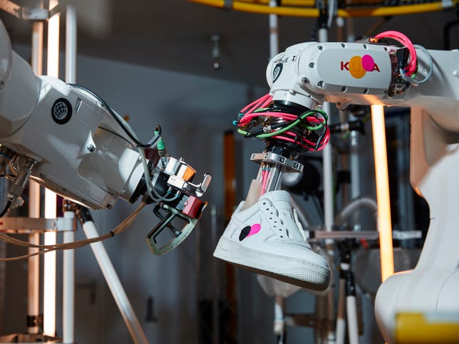 Nike's BILL machine applies a patch to a sneaker